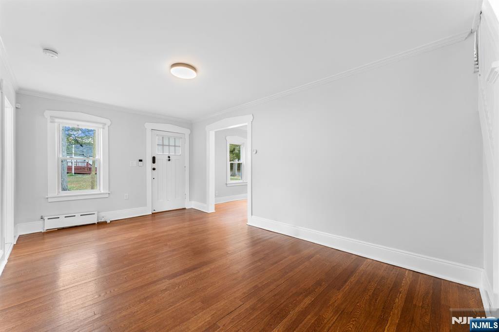177 East Pierrepont Avenue Rutherford, NJ 07070 - Photo 6 of 27 an empty room with wooden floor and windows