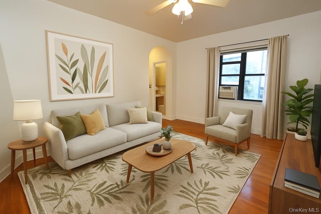 120 Stonelea Place, Unit 3M New Rochelle, NY 10801 - Photo 1 of 39 a living room with furniture and a large window