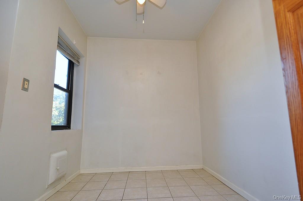 120 Stonelea Place, Unit 3M New Rochelle, NY 10801 - Photo 19 of 39 a view of an empty room with a window
