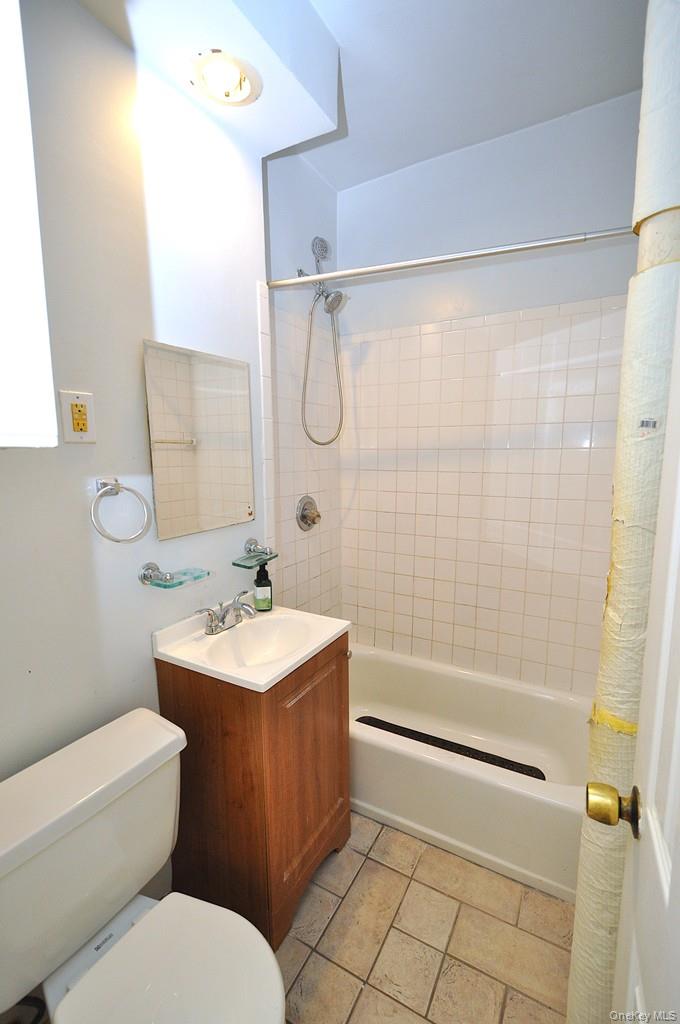 120 Stonelea Place, Unit 3M New Rochelle, NY 10801 - Photo 22 of 39 a bathroom with a sink toilet and shower