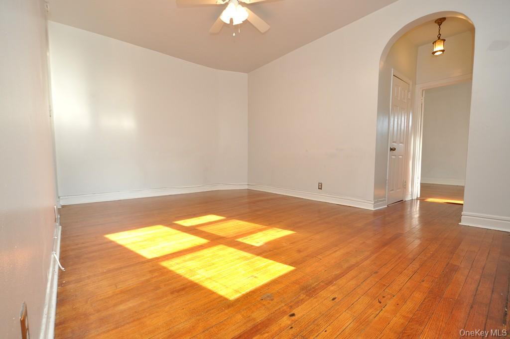 120 Stonelea Place, Unit 3M New Rochelle, NY 10801 - Photo 37 of 39 wooden floor in an empty room with a window