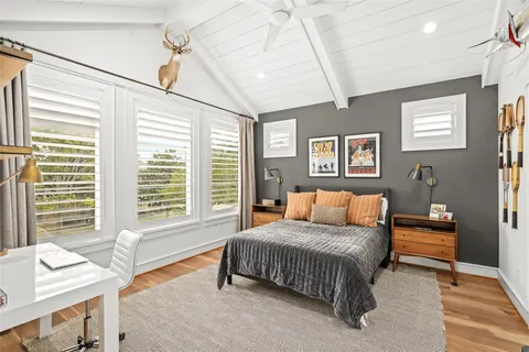 a bathroom with a granite countertop toilet sink and a mirror