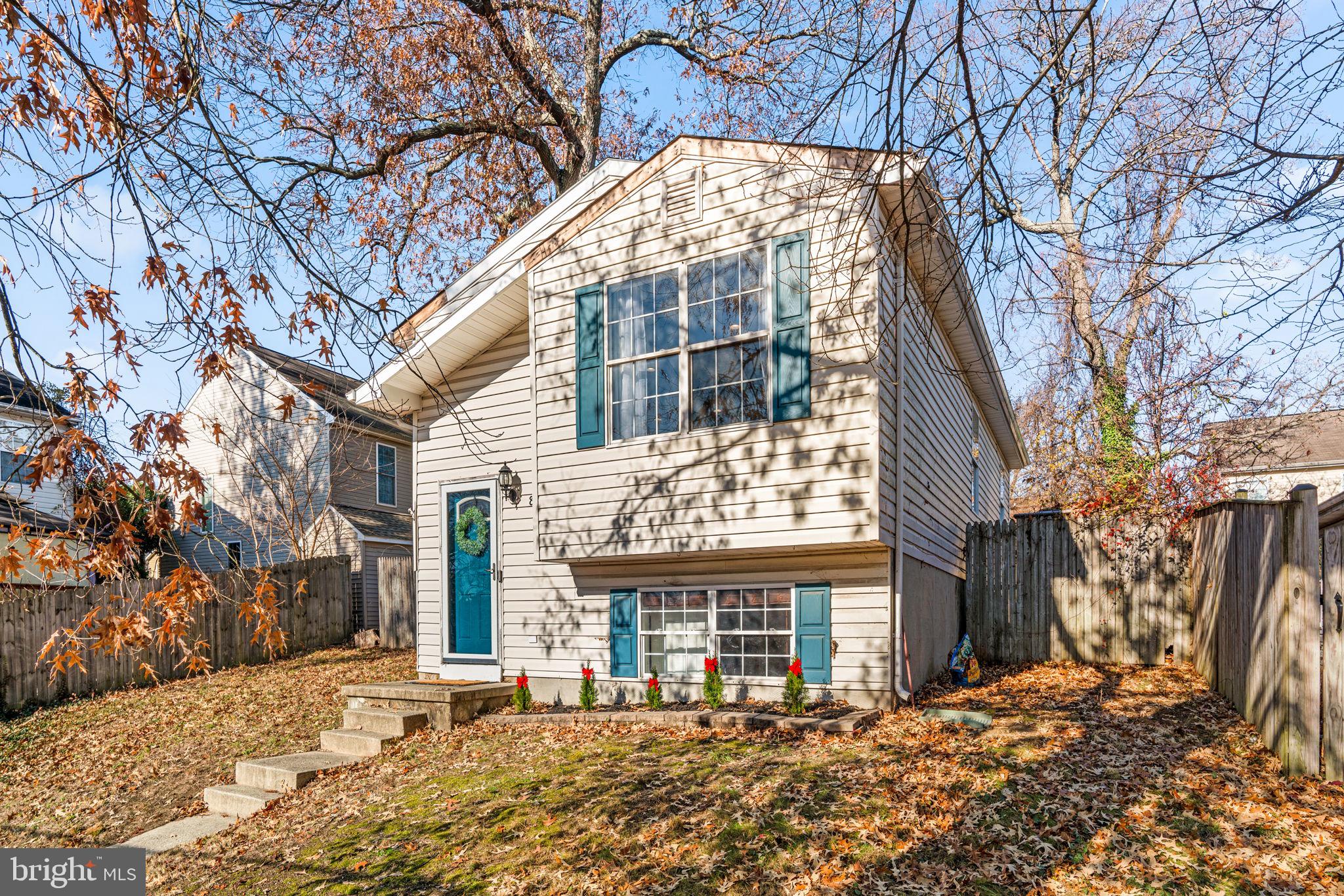 802 203rd Street Pasadena, MD 21122 - Photo 1 of 37 a front view of a house with a yard