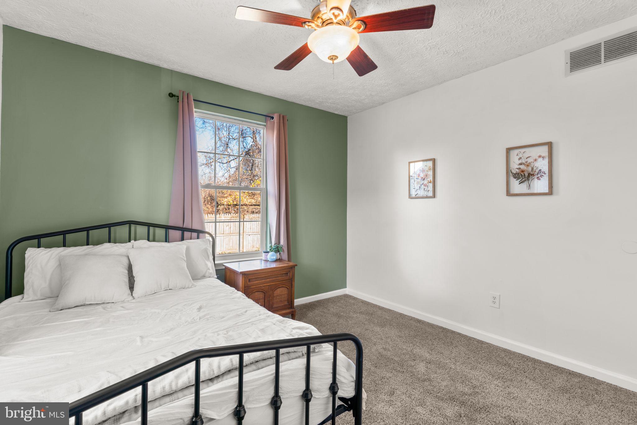 802 203rd Street Pasadena, MD 21122 - Photo 19 of 37 a bedroom with a bed and window
