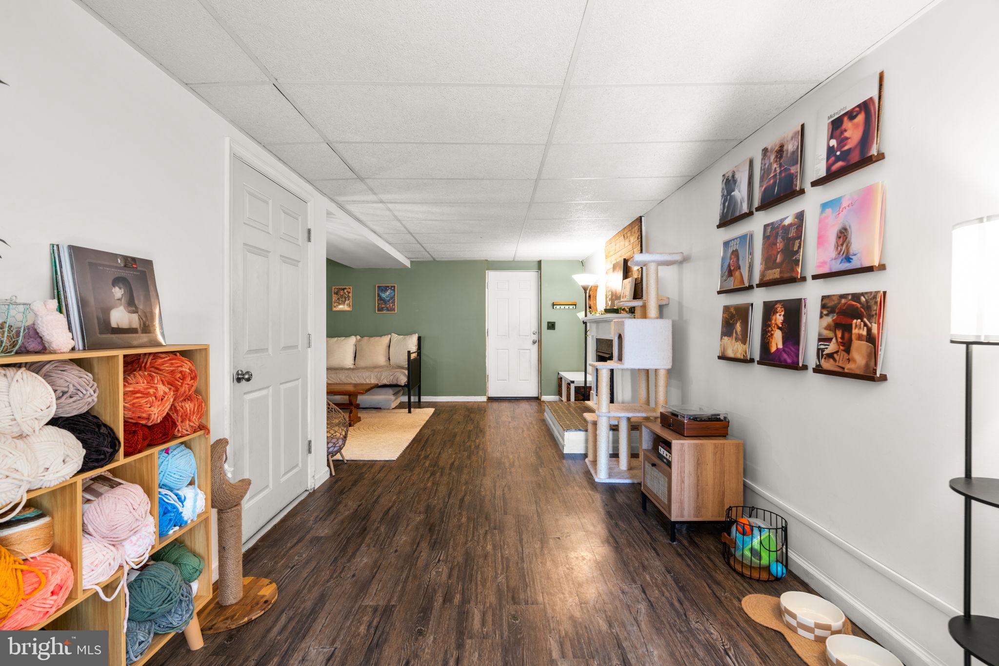802 203rd Street Pasadena, MD 21122 - Photo 23 of 37 a living room with furniture and a book shelf