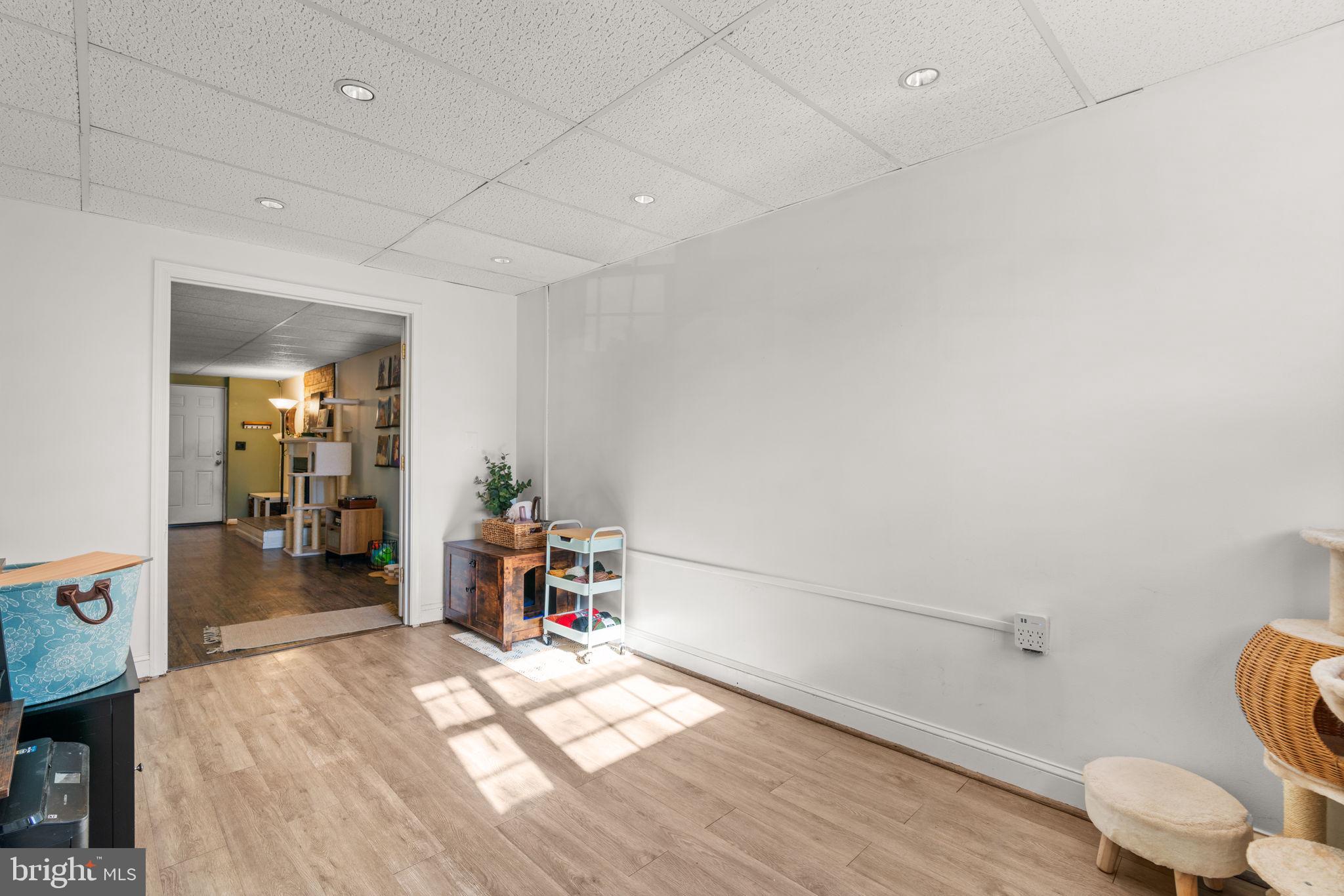 802 203rd Street Pasadena, MD 21122 - Photo 30 of 37 a bedroom with furniture and a wooden floor