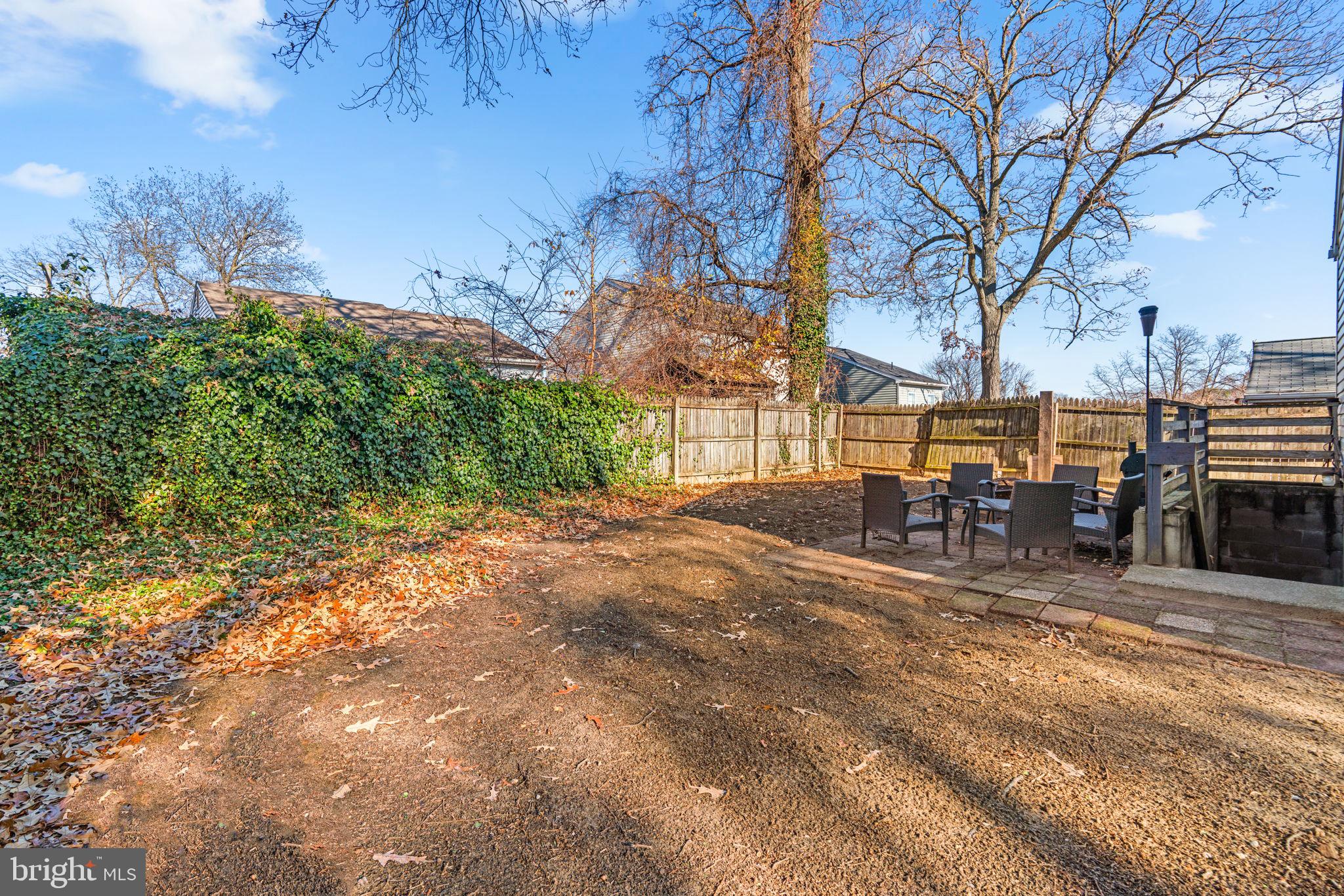 802 203rd Street Pasadena, MD 21122 - Photo 32 of 37 a view of a yard with table and chairs