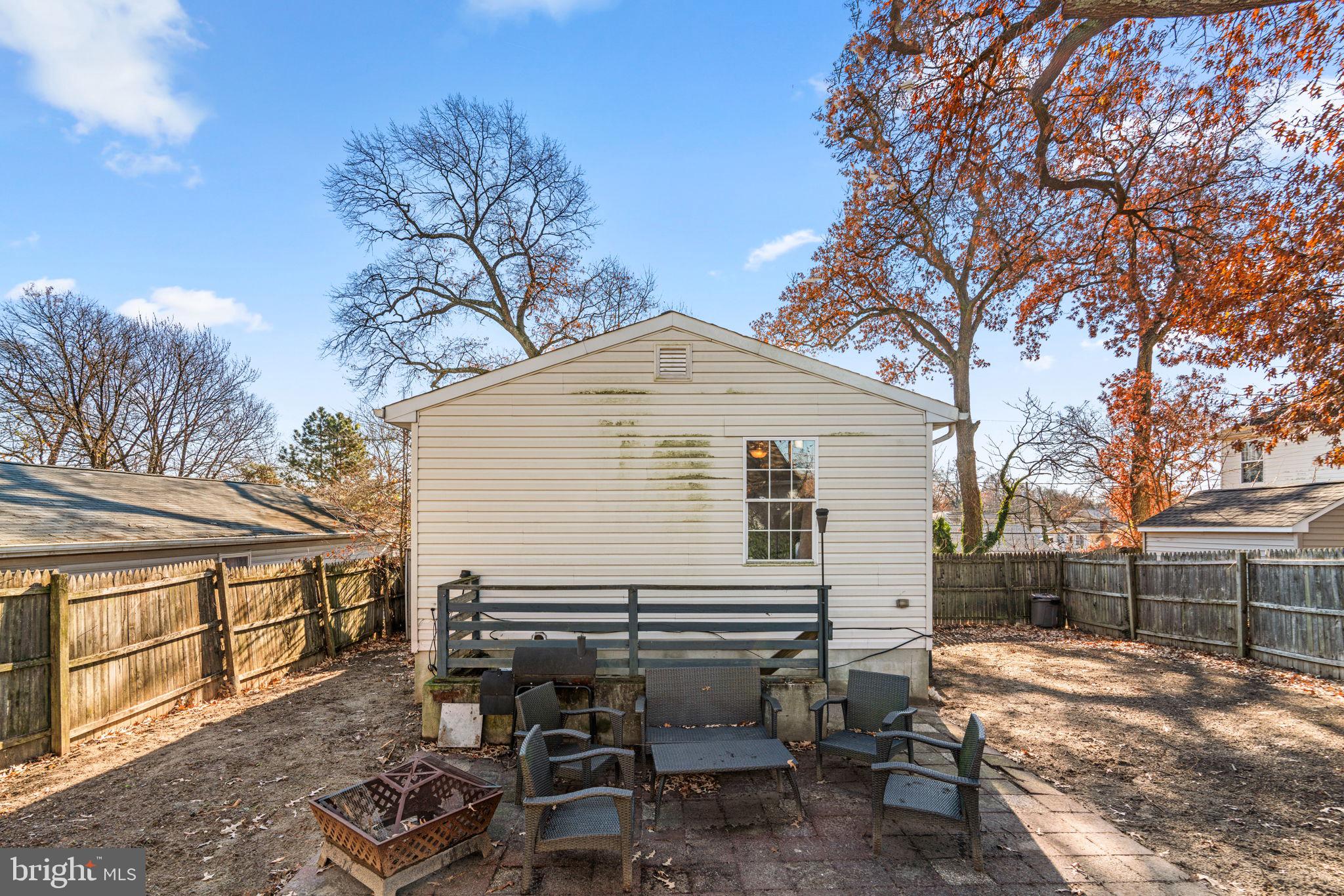802 203rd Street Pasadena, MD 21122 - Photo 34 of 37 a view of backyard with outdoor seating and trees