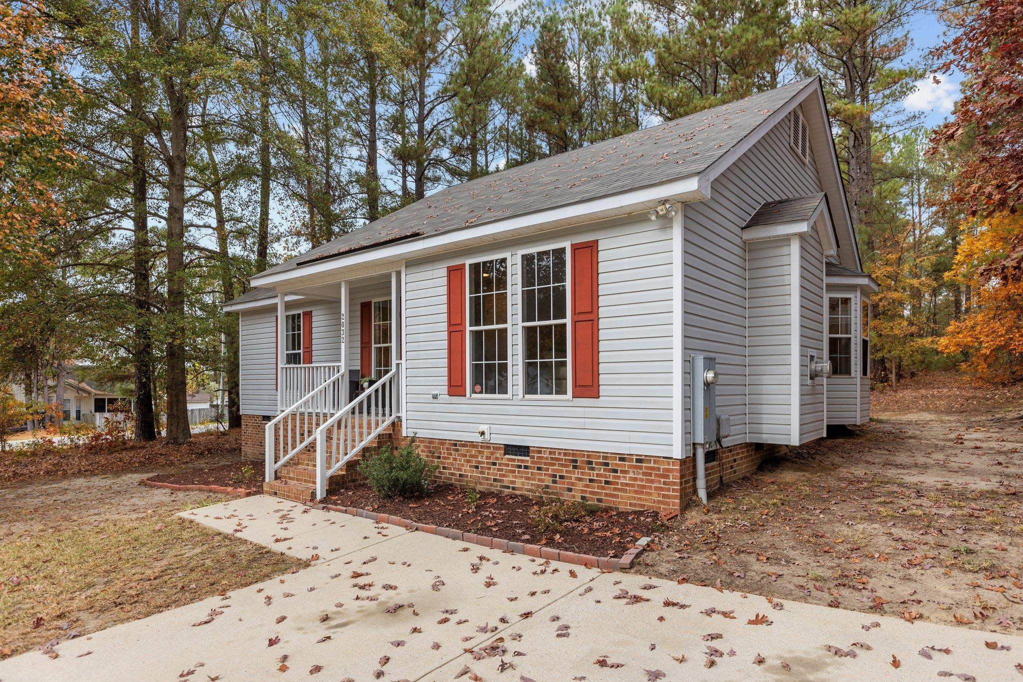 2032 Ruddy Road Raleigh, NC 27616 - Photo 23 of 27 a front view of a house with a yard