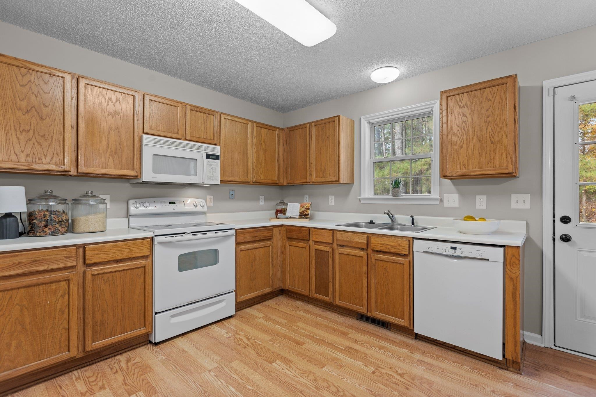 2032 Ruddy Road Raleigh, NC 27616 - Photo 8 of 27 a kitchen with stainless steel appliances granite countertop a sink and cabinets