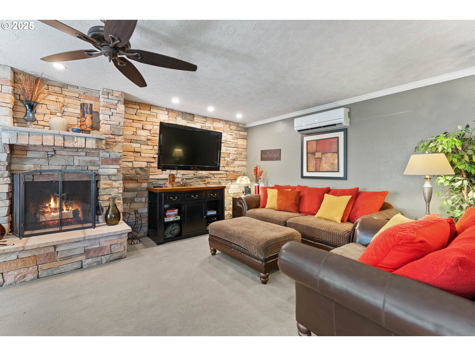 218 2nd Street Klickitat, WA 98628 - Photo 12 of 28 a living room with furniture a fireplace and a flat screen tv