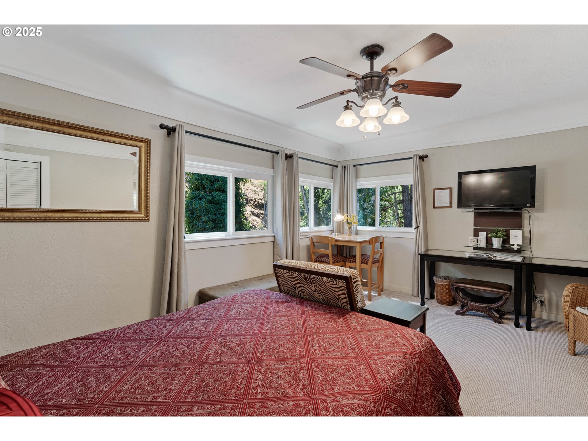 218 2nd Street Klickitat, WA 98628 - Photo 20 of 28 a bedroom with a bed and a flat screen tv