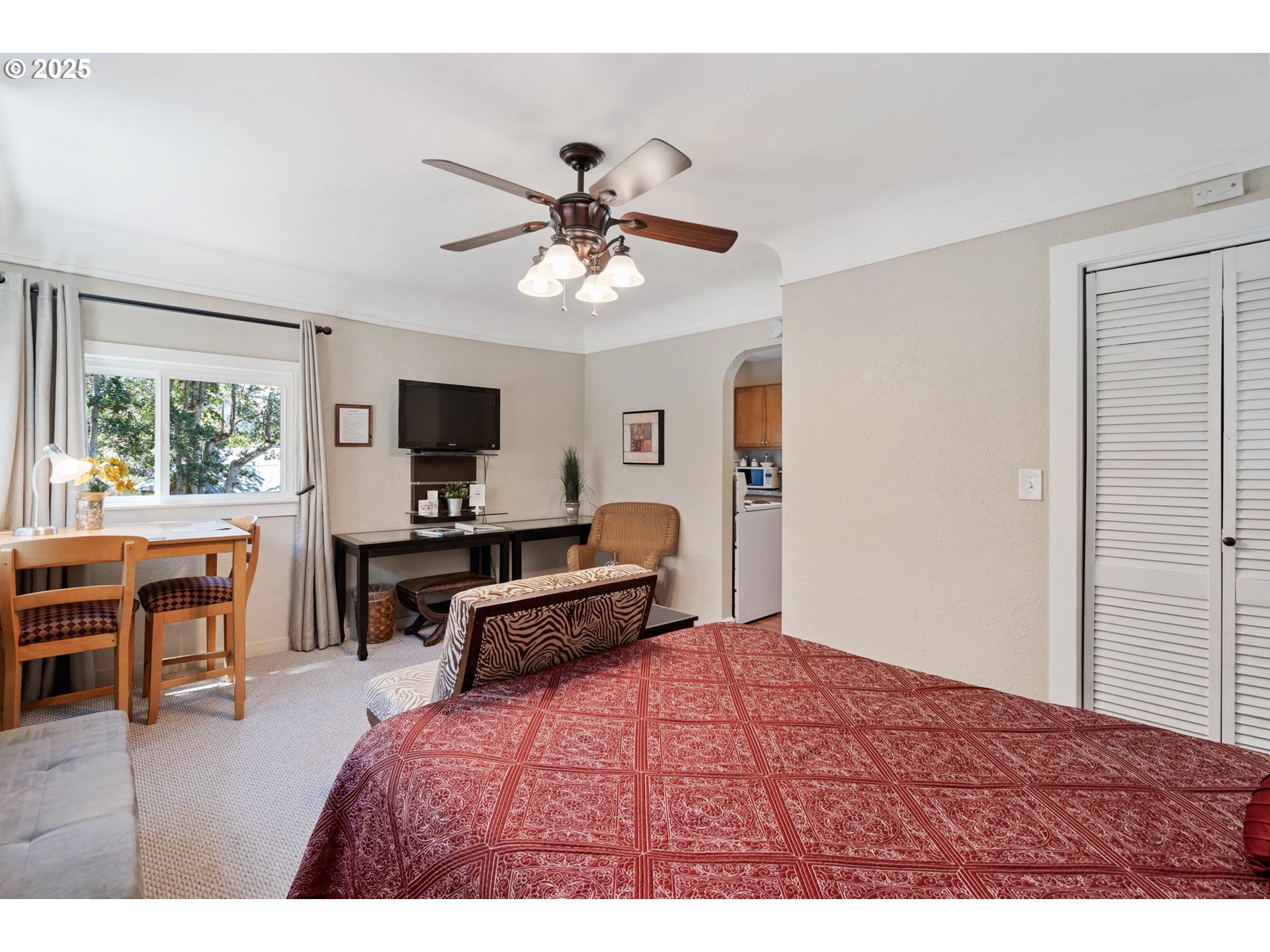 218 2nd Street Klickitat, WA 98628 - Photo 21 of 28 a bedroom with a bed and a flat screen tv
