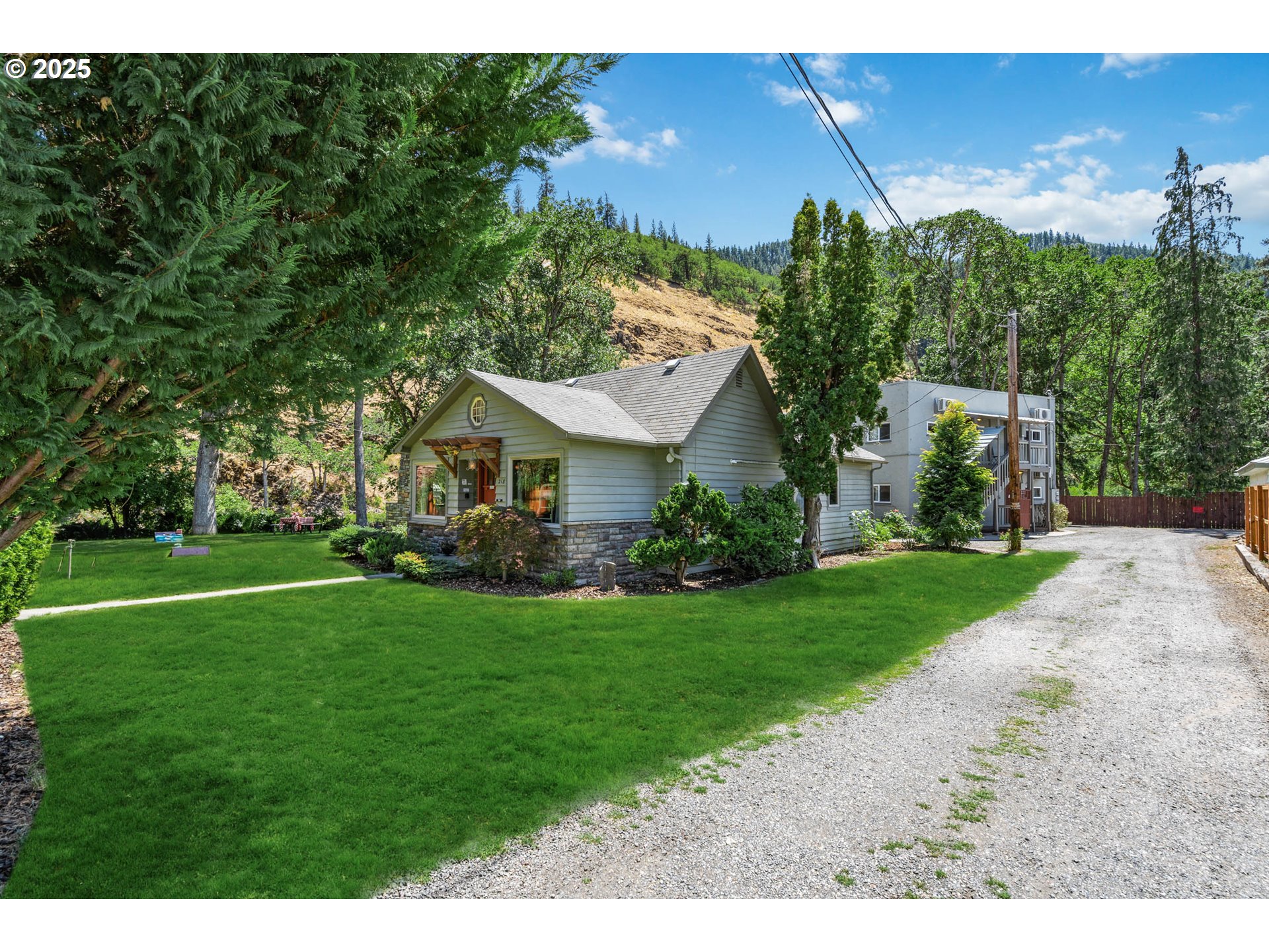 218 2nd Street Klickitat, WA 98628 - Photo 25 of 28 a front view of a house with a yard