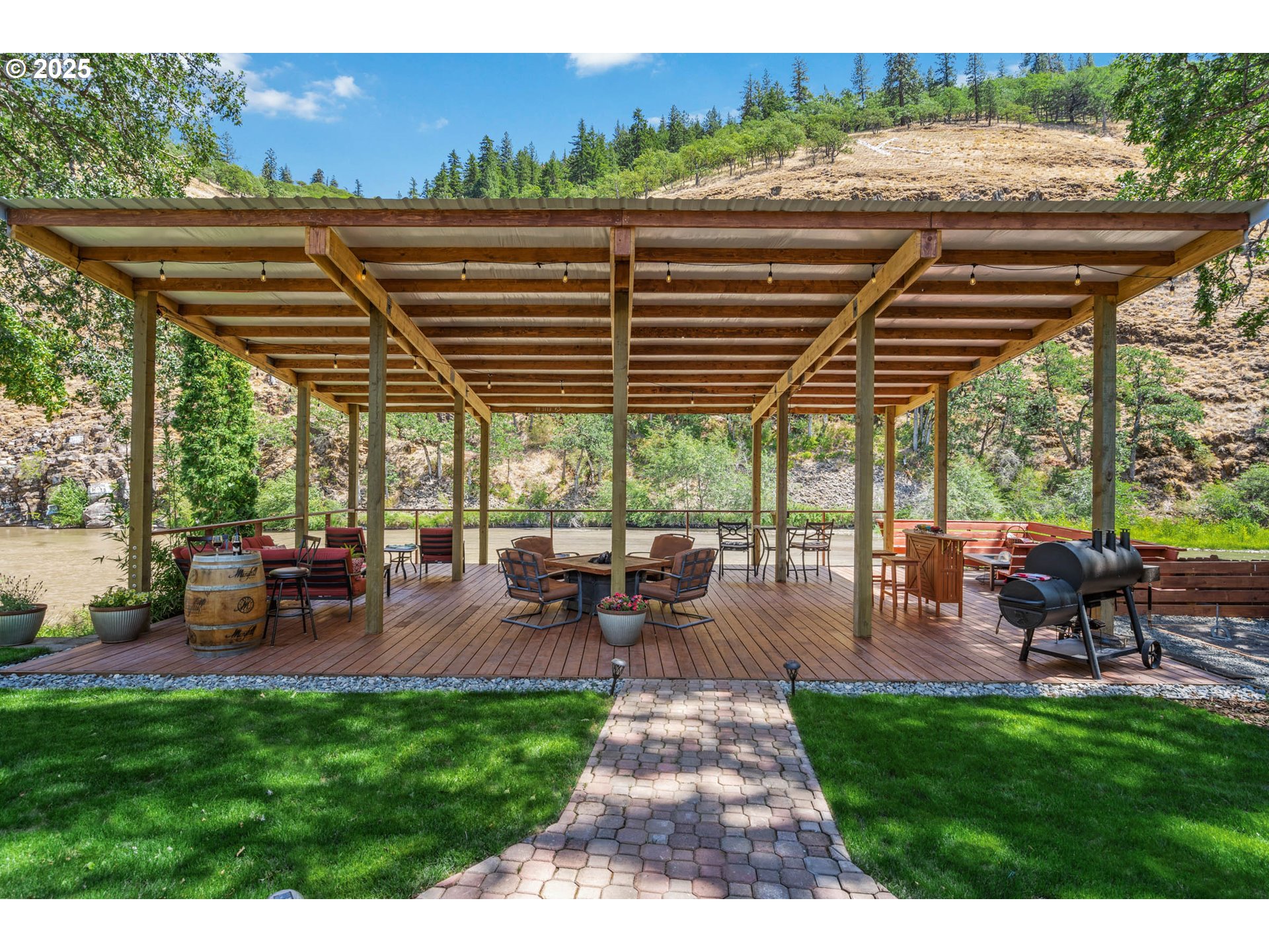 218 2nd Street Klickitat, WA 98628 - Photo 26 of 28 a view of a patio with a table chairs and a patio