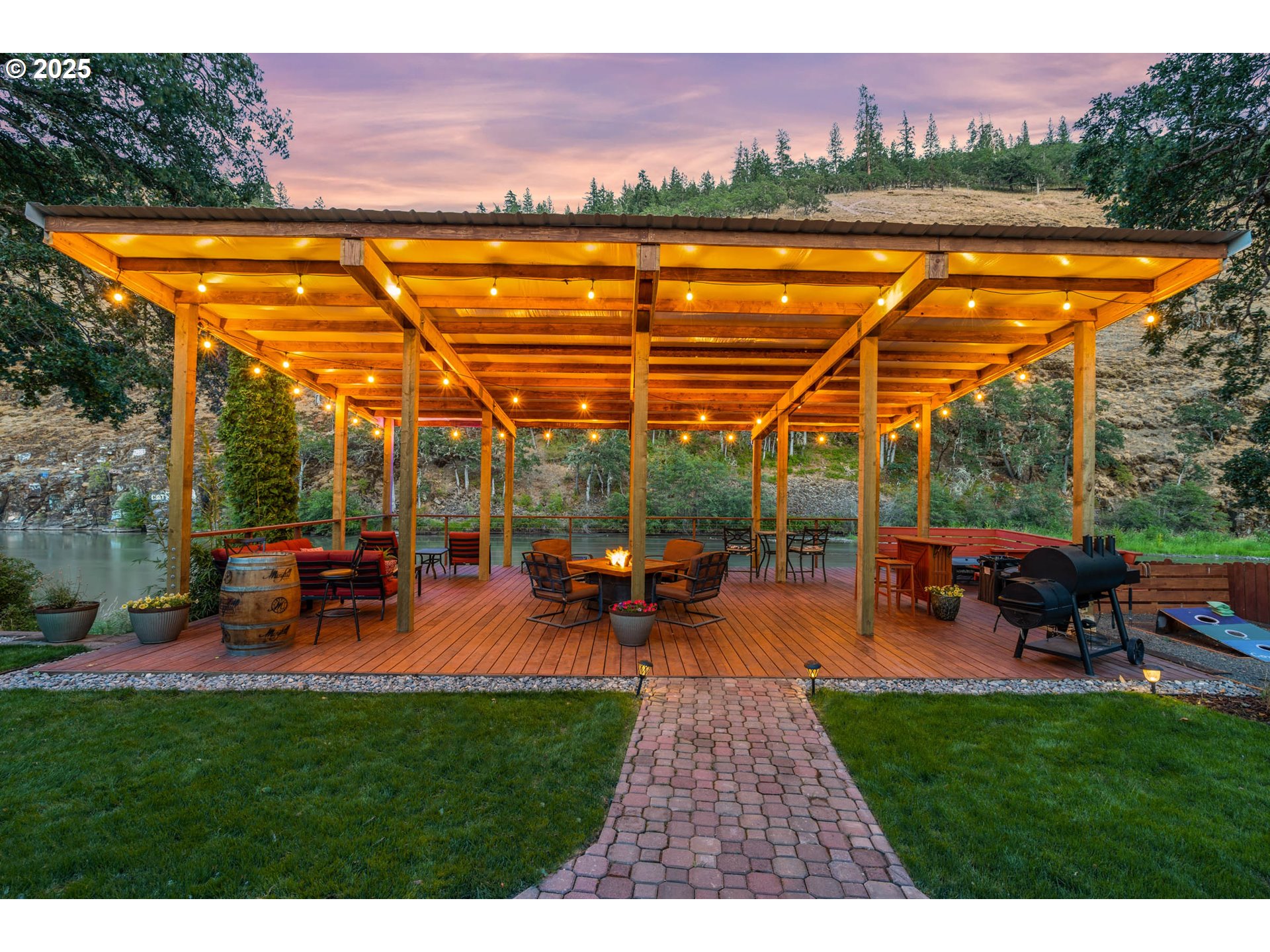 218 2nd Street Klickitat, WA 98628 - Photo 3 of 28 a view of a swimming pool with lawn chairs and a yard
