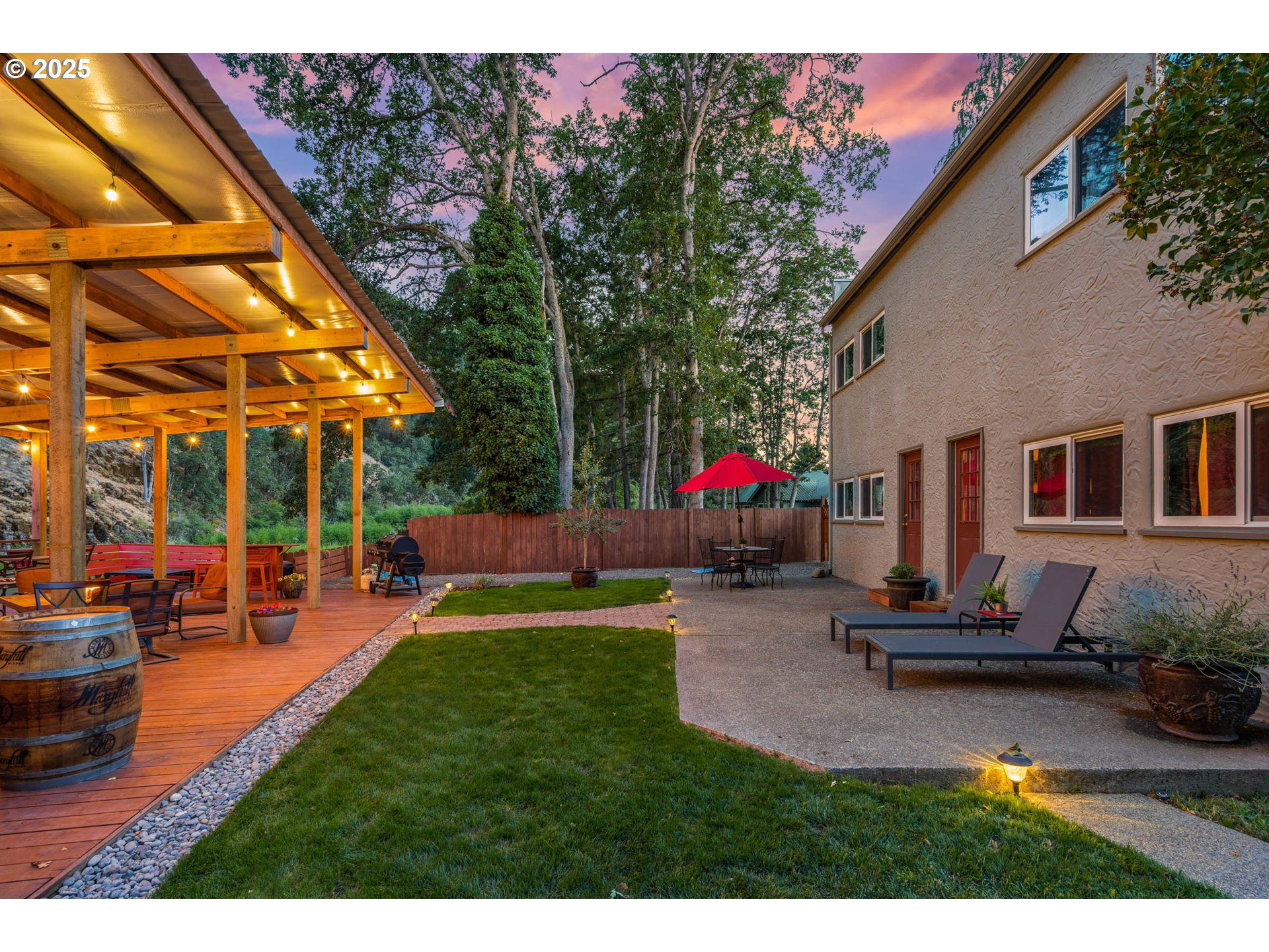 218 2nd Street Klickitat, WA 98628 - Photo 9 of 28 a view of a backyard with plants and a patio