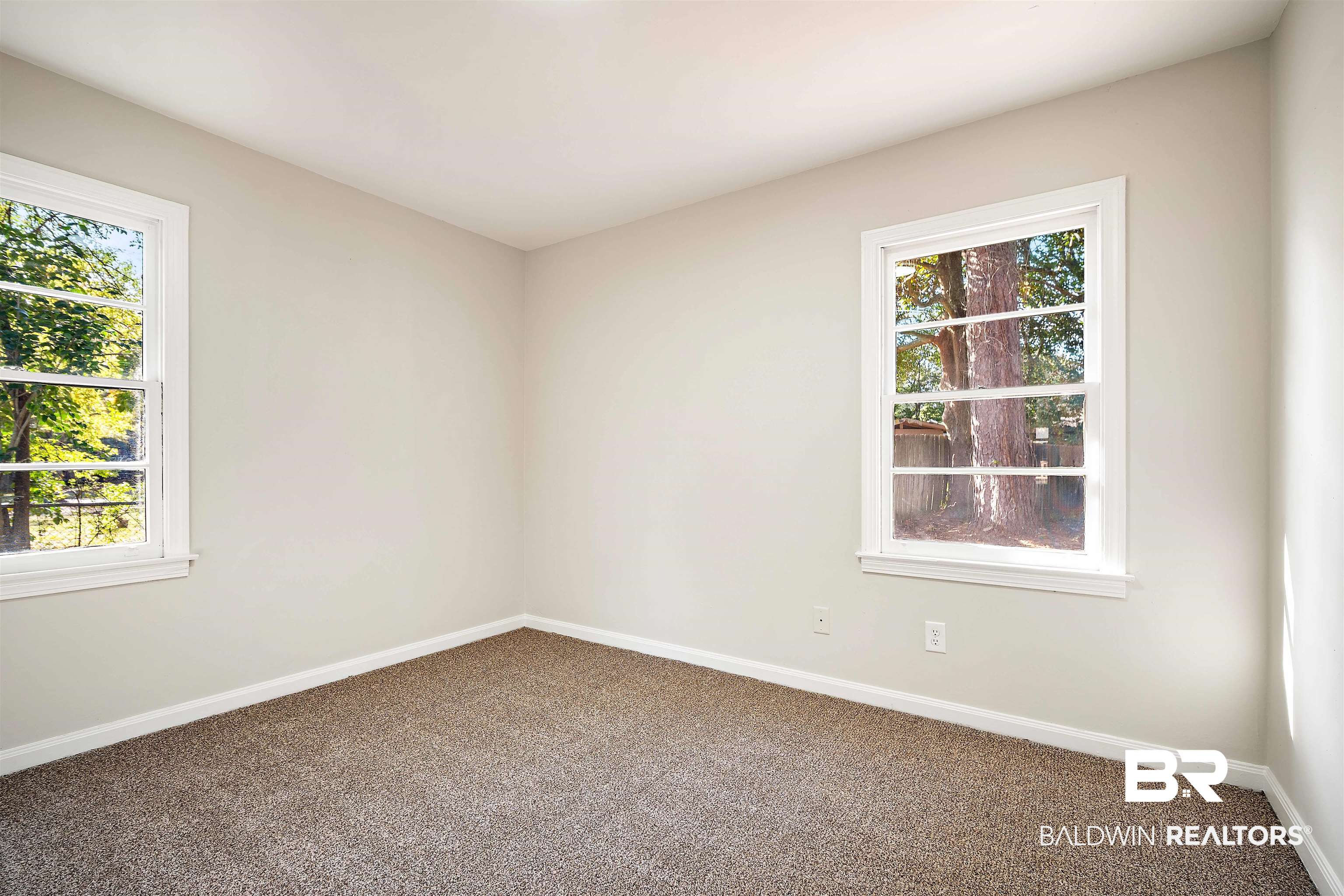 662 Merritt Drive Mobile, AL 36609 - Photo 18 of 21 Empty room with carpet and a healthy amount of sunlight