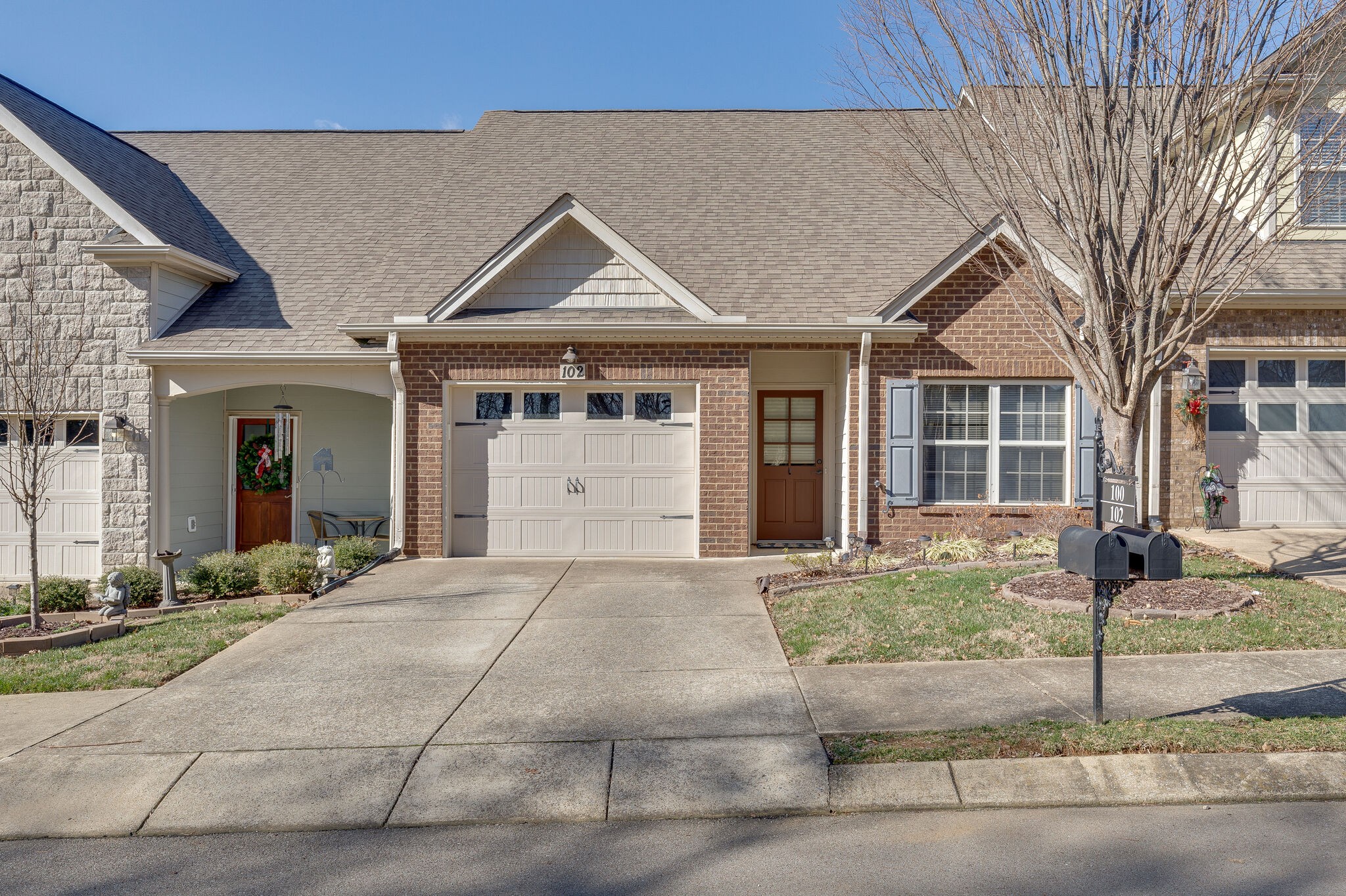 102 Westview Drive Spring Hill, TN 37174 - Photo 1 of 27 a front view of a house with a yard and garage