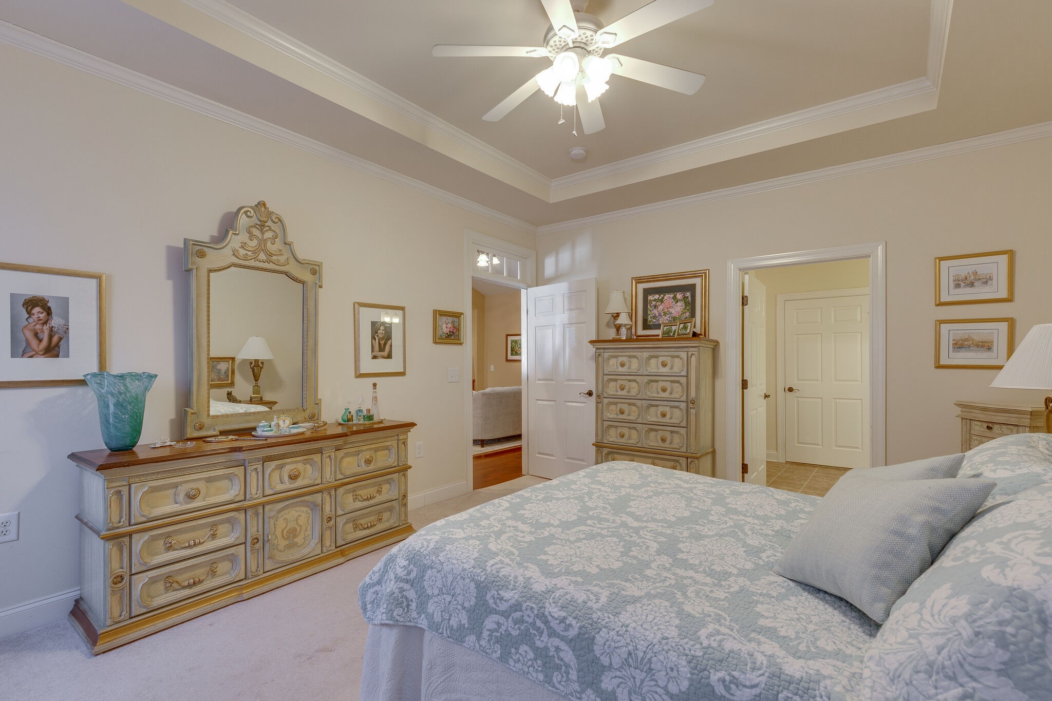 102 Westview Drive Spring Hill, TN 37174 - Photo 15 of 27 a bedroom with a bed and a chandelier