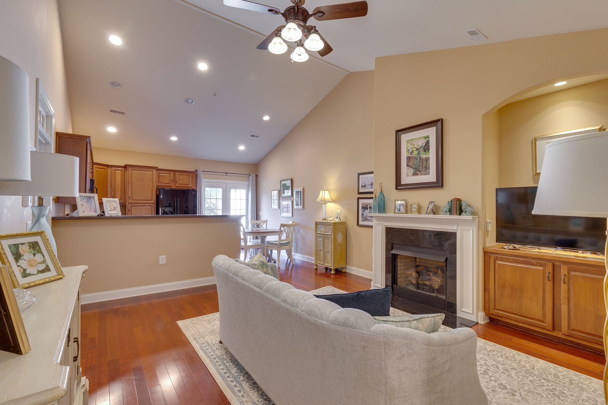 102 Westview Drive Spring Hill, TN 37174 - Photo 6 of 27 a living room with furniture a fireplace and a flat screen tv