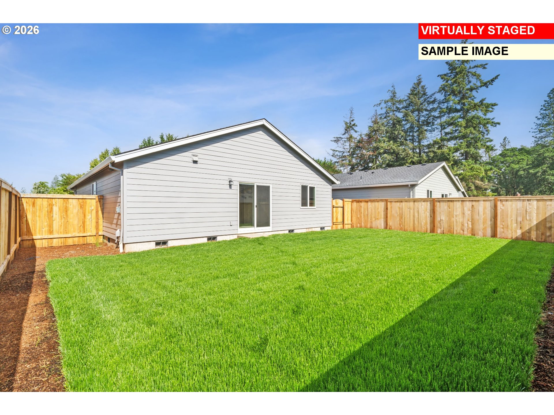25229 Todd Way Veneta, OR 97487 - Photo 2 of 29 a view of a backyard with a garden and garage