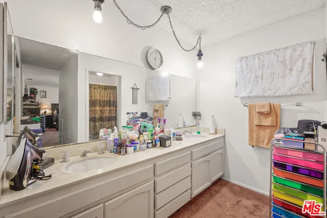 a view of storage and utility room with two washing machine