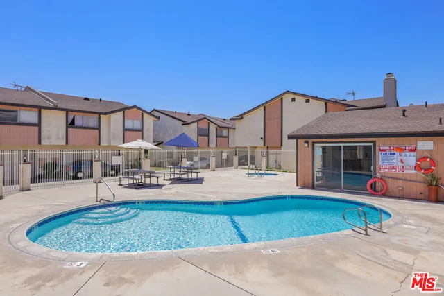 a view of a house with outdoor space and sitting area