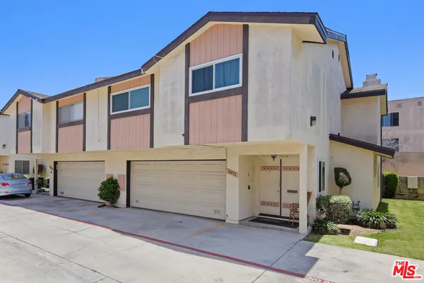 a view of a house with a garage