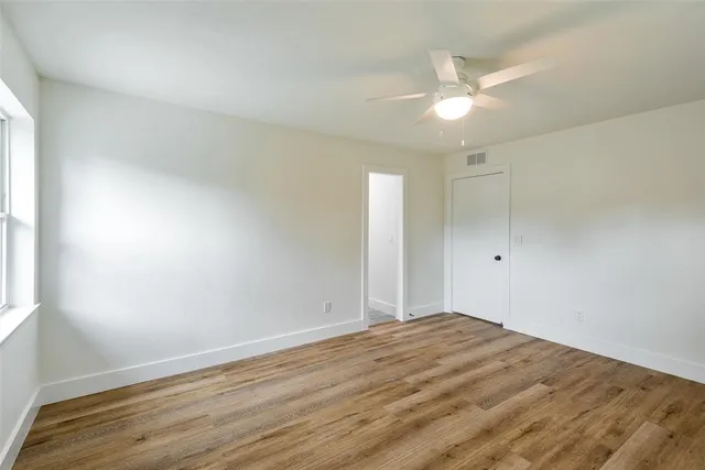 a kitchen with granite countertop a sink a counter space appliances and cabinets