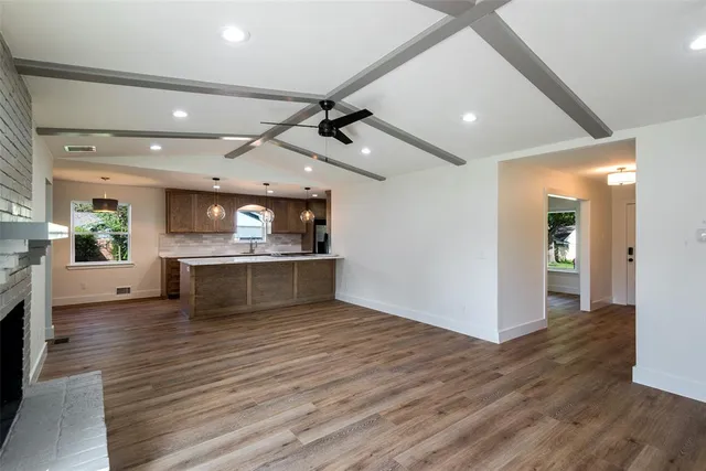 a bathroom with a window and a shower