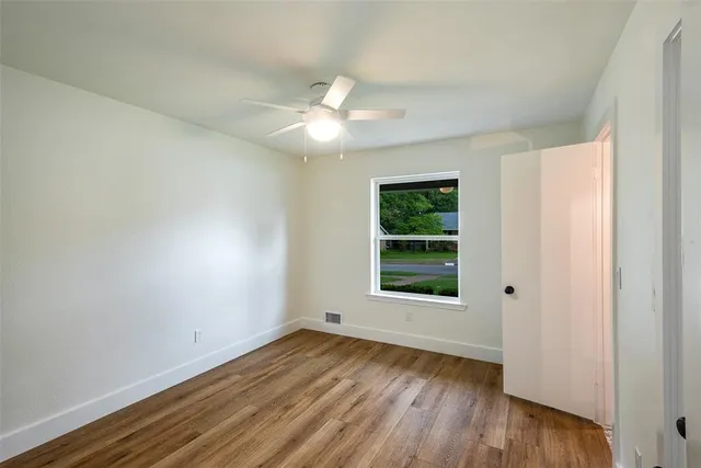 a bathroom with double vanity sink and mirror