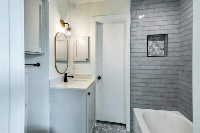 a bathroom with a shower and mirror
