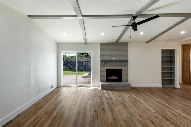 a view of a kitchen center island wooden floor and kitchen view