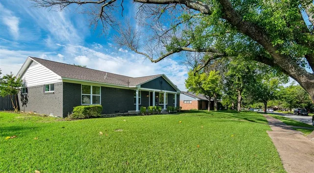 a view of a house with a garden