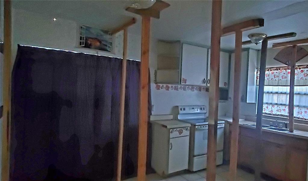 2208 Valencia Road Orlando, FL 32803 - Photo 14 of 45 a kitchen with stainless steel appliances granite countertop a refrigerator and a sink