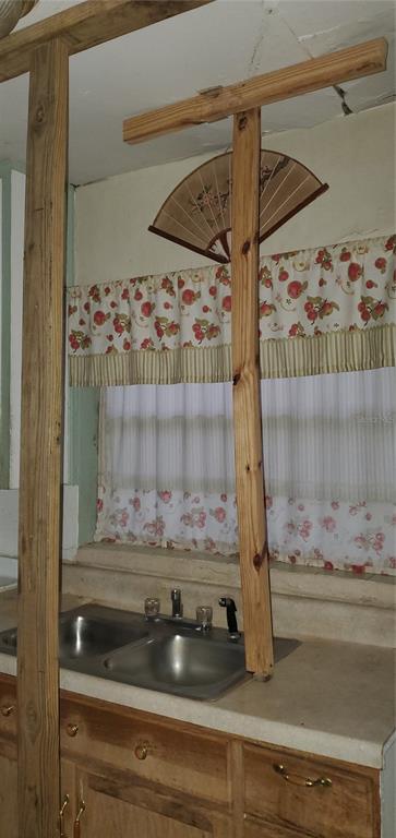 2208 Valencia Road Orlando, FL 32803 - Photo 20 of 45 a bathroom with a shower and a mirror