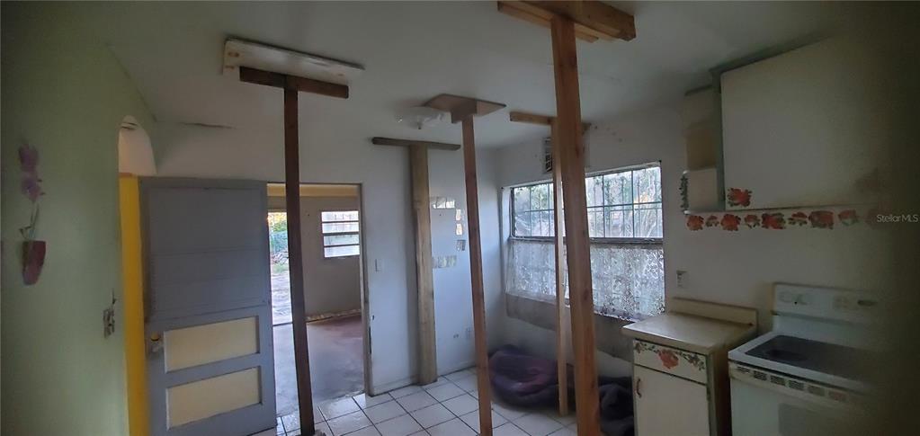 2208 Valencia Road Orlando, FL 32803 - Photo 22 of 45 a kitchen with stainless steel appliances granite countertop a refrigerator and a counter top space