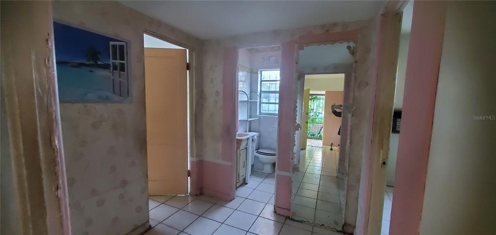 2208 Valencia Road Orlando, FL 32803 - Photo 28 of 45 a bathroom with a glass shower door and a bathroom