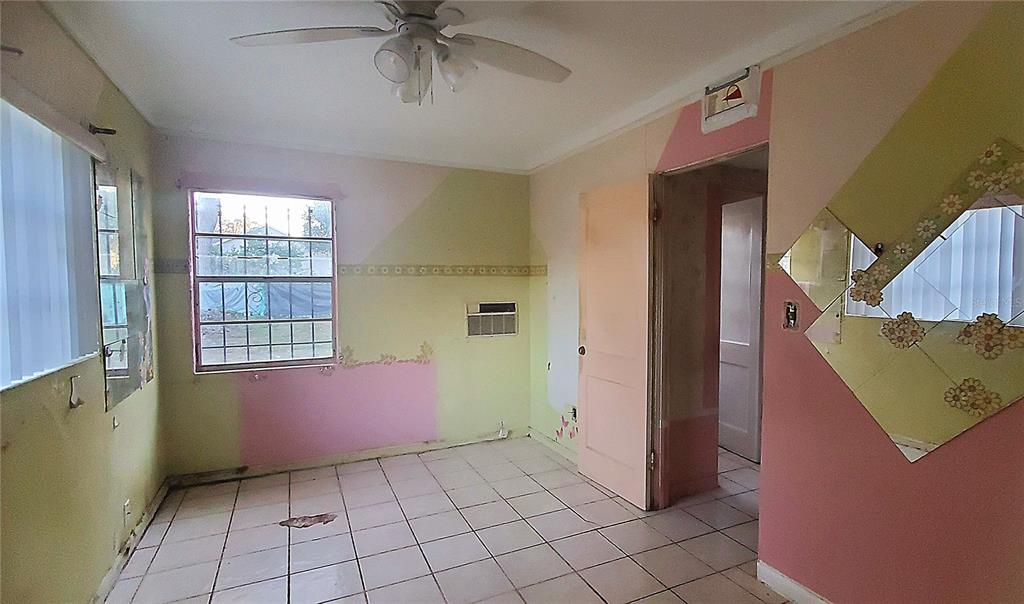 2208 Valencia Road Orlando, FL 32803 - Photo 29 of 45 a view of an empty room with window and cabinet