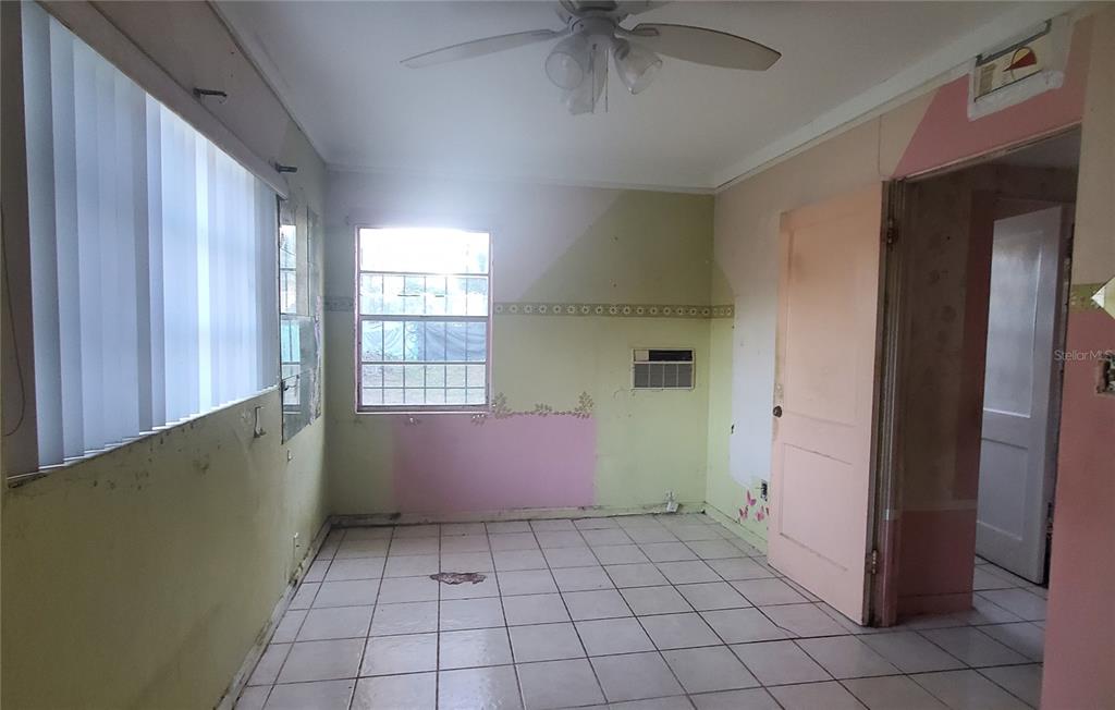 2208 Valencia Road Orlando, FL 32803 - Photo 30 of 45 a room with window and a chandelier fan