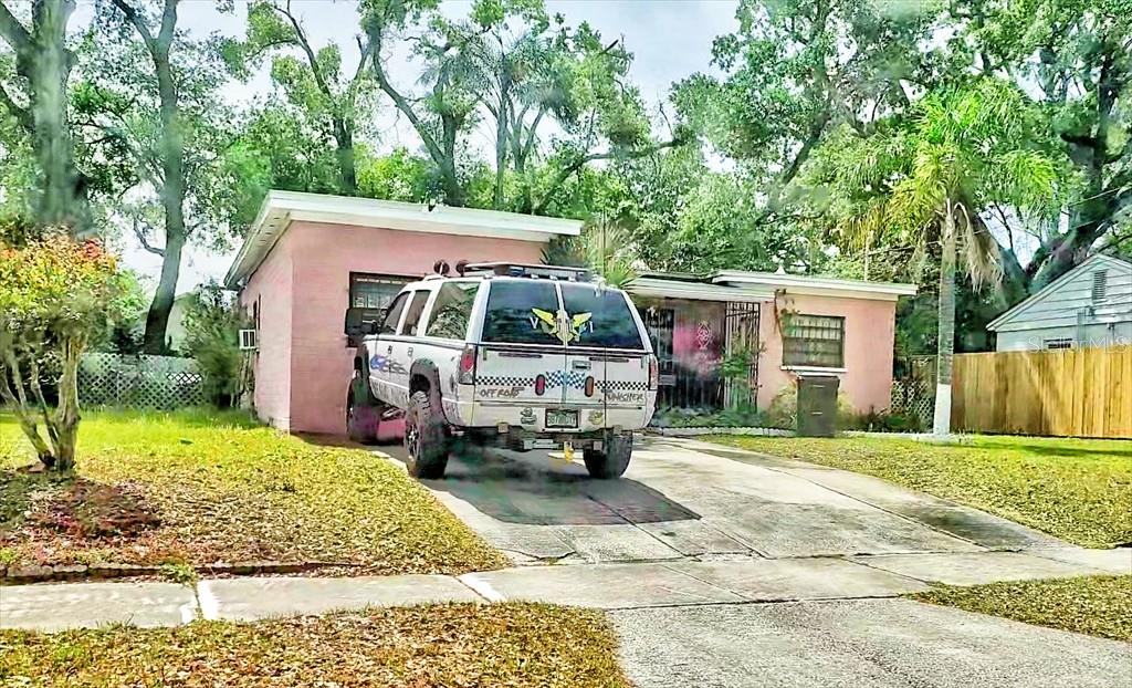 2208 Valencia Road Orlando, FL 32803 - Photo 3 of 45 a view of a white house and a small yard