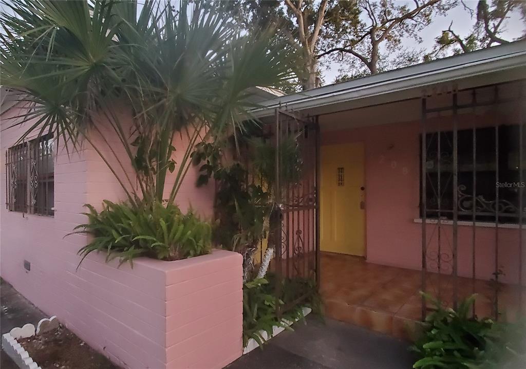 2208 Valencia Road Orlando, FL 32803 - Photo 5 of 45 a front view of a house with a yard