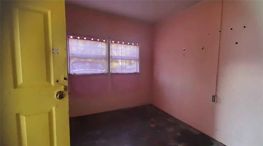 2208 Valencia Road Orlando, FL 32803 - Photo 8 of 45 a view of an empty room with a window