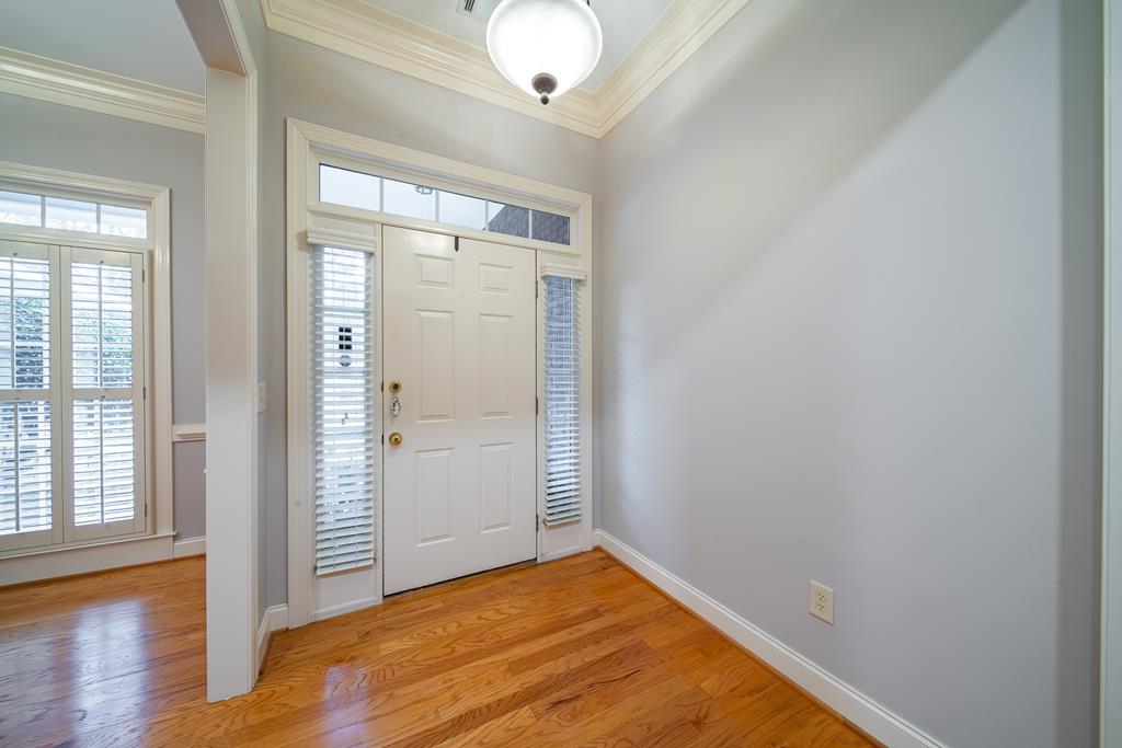 4571 Carnoustie Lane Columbus, GA 31909 - Photo 12 of 49 an empty room with wooden floor and windows