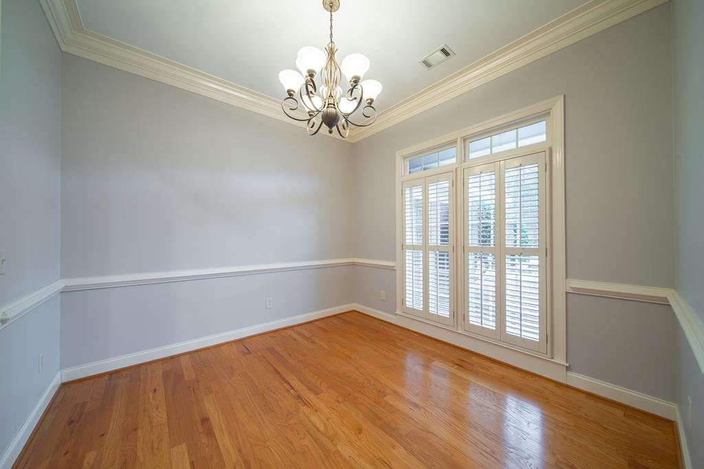 4571 Carnoustie Lane Columbus, GA 31909 - Photo 13 of 49 a view of empty room with wooden floor and fan