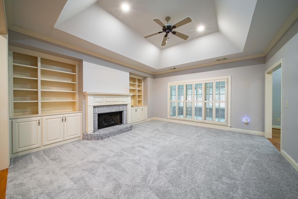 4571 Carnoustie Lane Columbus, GA 31909 - Photo 15 of 49 a view of an empty room with a fireplace and a window