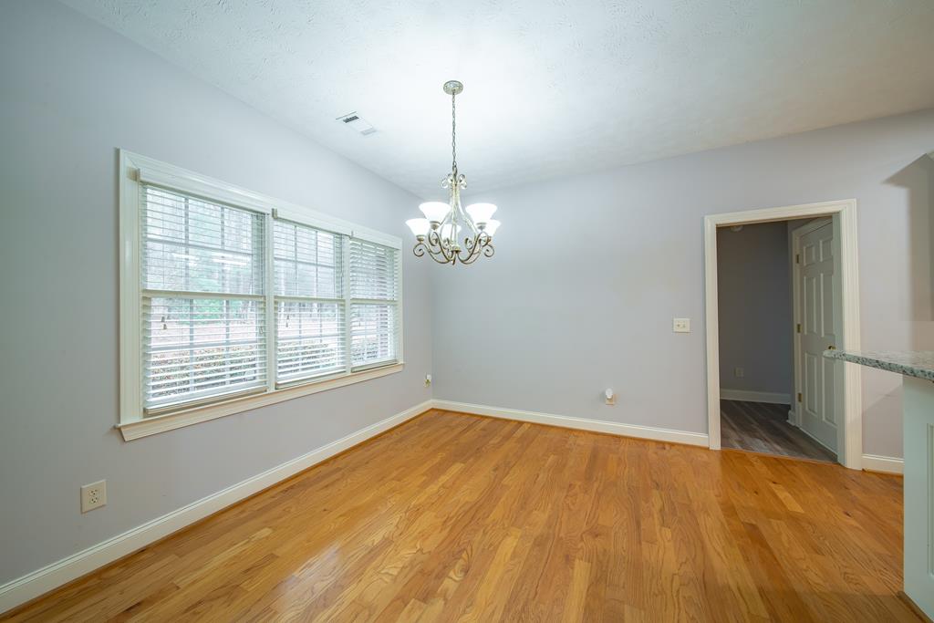 4571 Carnoustie Lane Columbus, GA 31909 - Photo 17 of 49 a view of empty room with wooden floor and fan