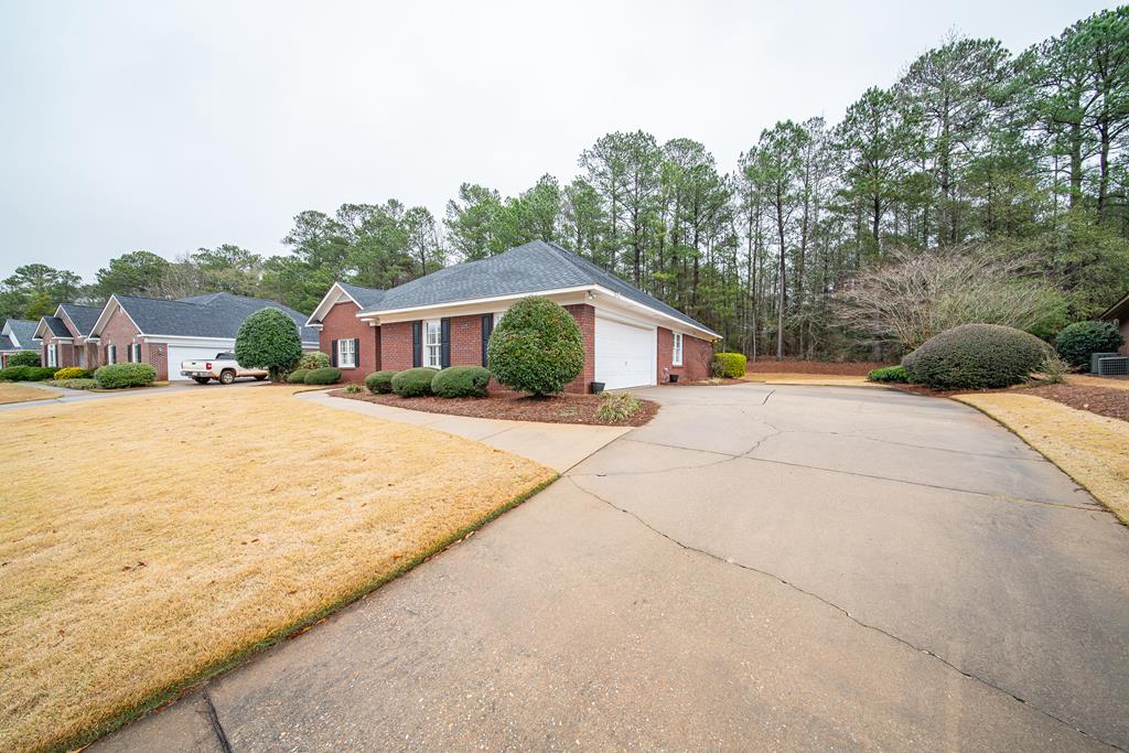 4571 Carnoustie Lane Columbus, GA 31909 - Photo 2 of 49 a house with trees in front of it