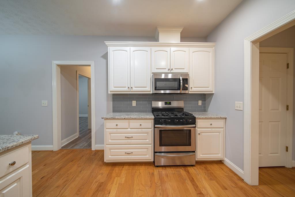 4571 Carnoustie Lane Columbus, GA 31909 - Photo 23 of 49 a kitchen with stainless steel appliances a stove and a refrigerator